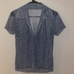 Blue and white flower, mesh collared shirt with a tie in the front